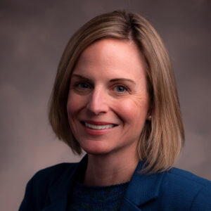 Photo of Sarah Bunnell in front of grey background