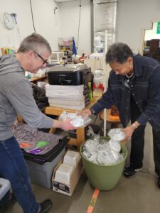 Rob Rodier and Felita Williams sorting hardware